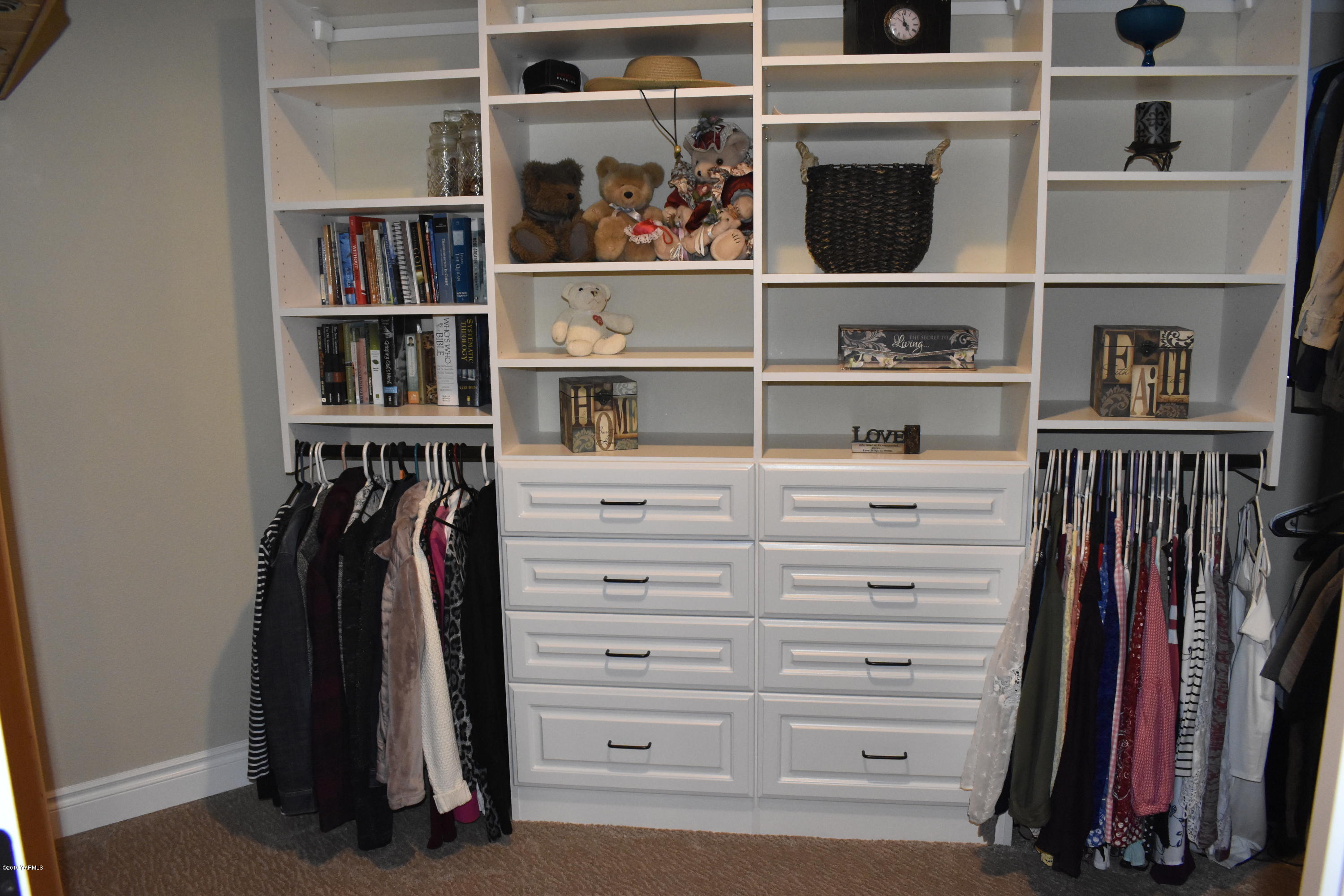 9709 Grunewald Road Yakima, WA 98908 - Photo 35 of 42 a view of walk in closet with clothes and shoes