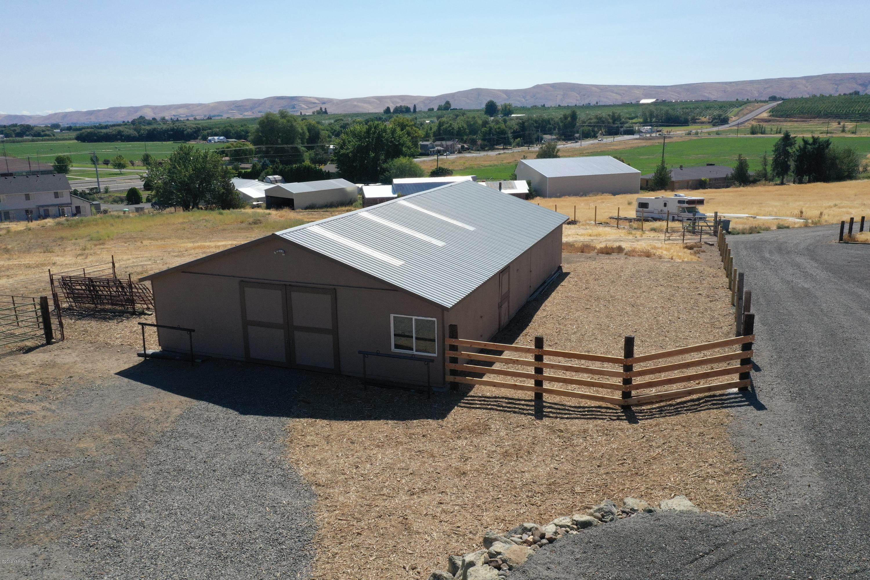 9709 Grunewald Road Yakima, WA 98908 - Photo 7 of 42 an aerial view of a house with a yard and lake view