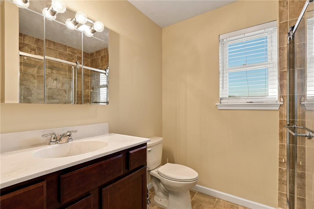 1657 Rachel Road Stroudsburg, PA 18360 - Photo 26 of 46 Tiled flooring and a glass-enclosed shower stall define this functional bathroom layout.