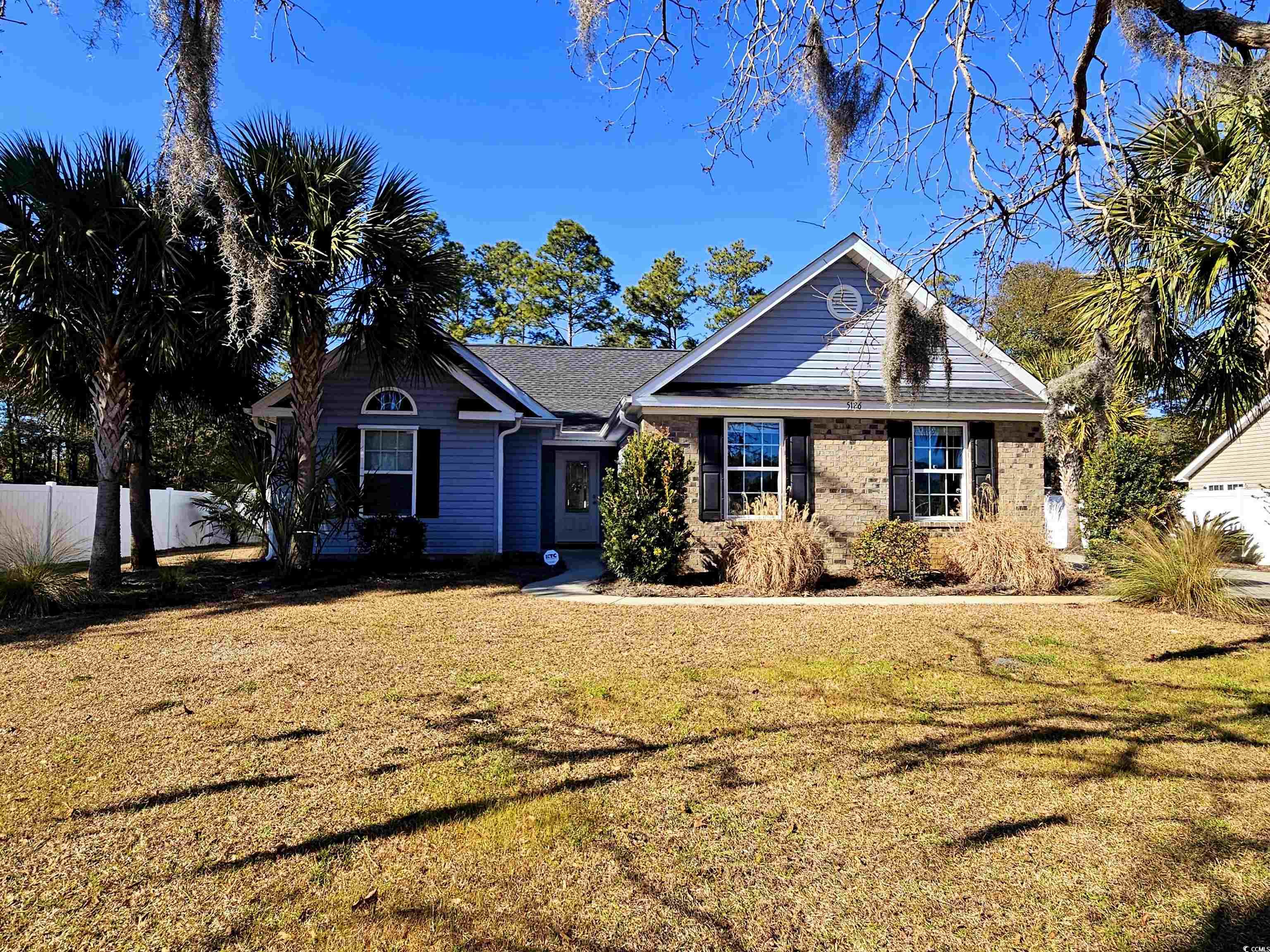 5126 Wesley Road Murrells Inlet, SC 29576 - Photo 1 of 33 Ranch-style house featuring a front lawn