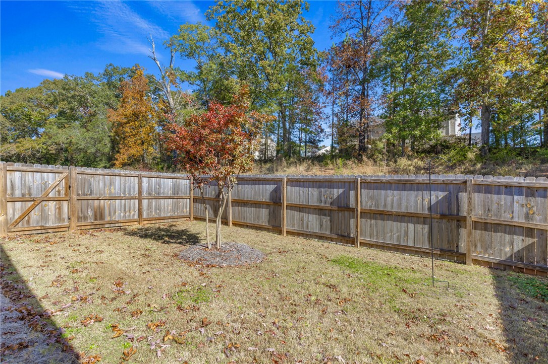 24 Chalet Court Anderson, SC 29621 - Photo 30 of 39 This spacious, fenced yard offers privacy and a natural backdrop for outdoor enjoyment.