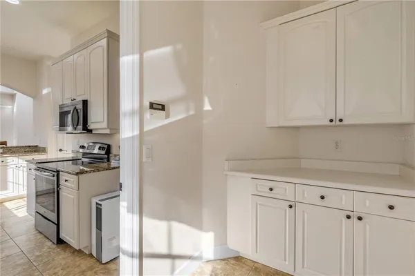 a bathroom with a sink a vanity and a mirror