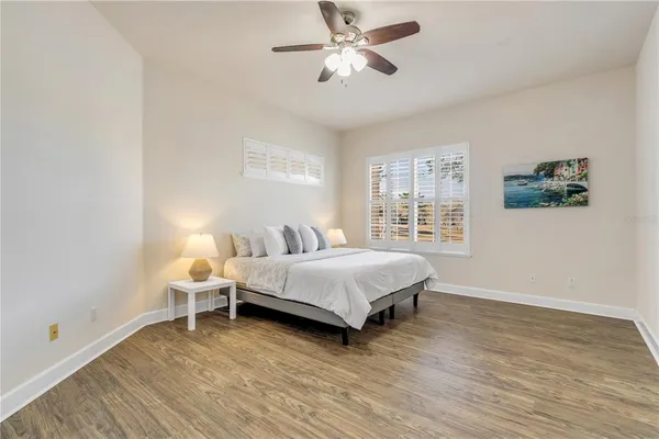 a bedroom with a large bed and a window