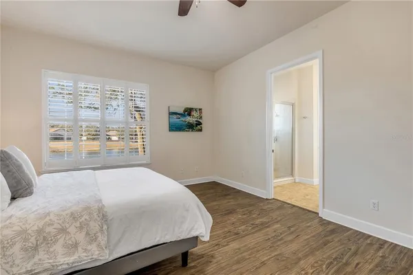 a view of a bedroom with a large window