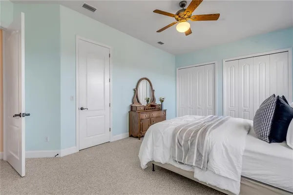 a house view with swimming pool in front of it