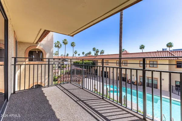 a view of a balcony with city view