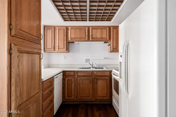 a kitchen with stainless steel appliances granite countertop a stove and a refrigerator