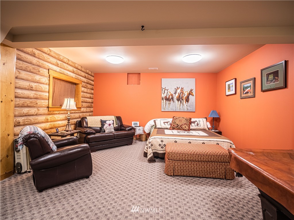 39 Cape Labelle Road Tonasket, WA 98855 - Photo 11 of 39 a bedroom with furniture and a couch