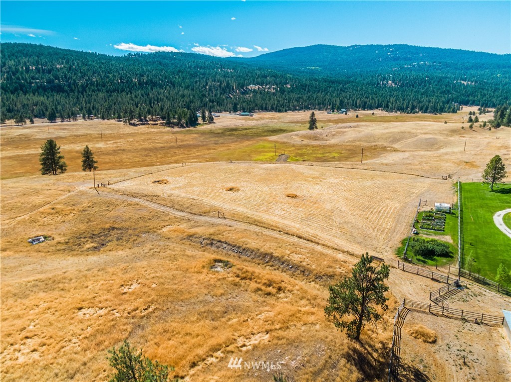 39 Cape Labelle Road Tonasket, WA 98855 - Photo 24 of 39 a view of an ocean and a yard