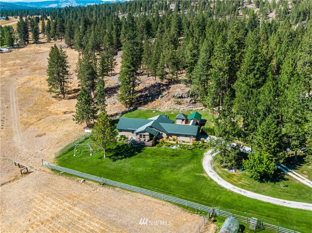 39 Cape Labelle Road Tonasket, WA 98855 - Photo 35 of 39 a view of a garden with a lake view