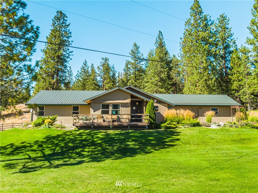 39 Cape Labelle Road Tonasket, WA 98855 - Photo 36 of 39 a front view of a house with garden