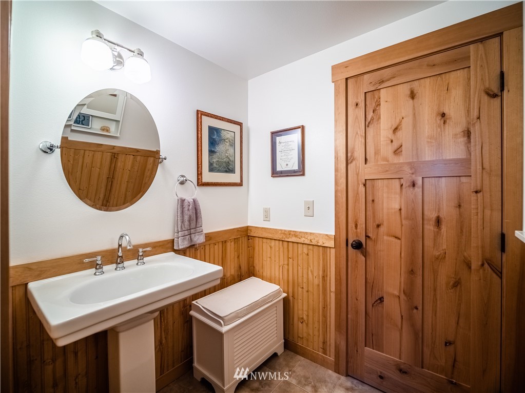 39 Cape Labelle Road Tonasket, WA 98855 - Photo 7 of 39 a bathroom with a sink and a mirror