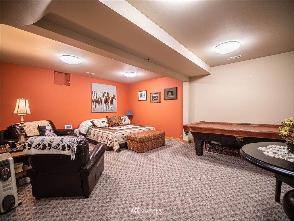 39 Cape Labelle Road Tonasket, WA 98855 - Photo 10 of 39 a bedroom with furniture and a couch
