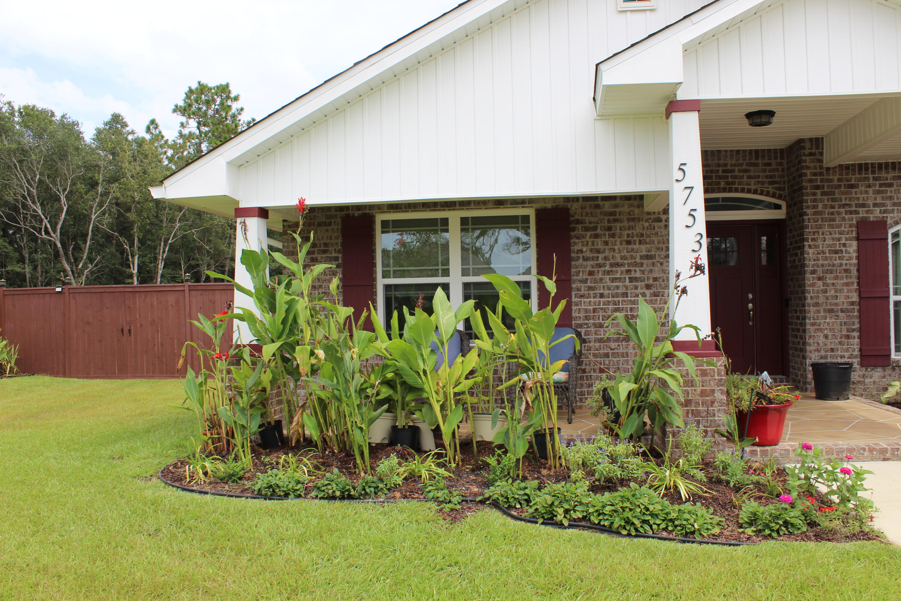5753 Marigold Loop Crestview, FL 32539 - Photo 4 of 51 a front view of a house with a yard