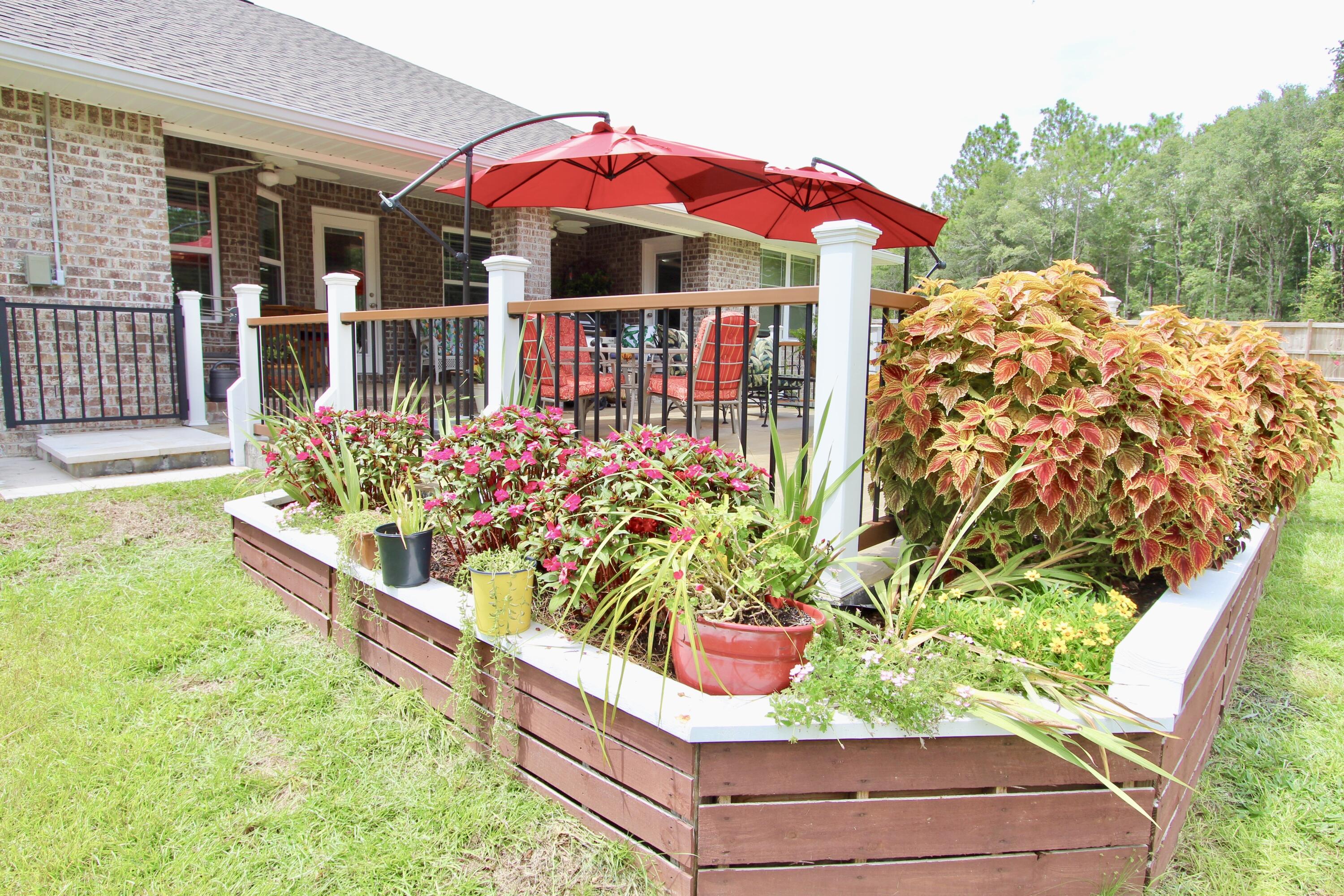 5753 Marigold Loop Crestview, FL 32539 - Photo 49 of 51 a view of a house with a yard and sitting area