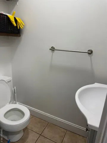 a bedroom with a bed and a night stand