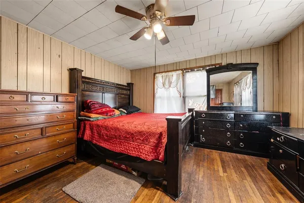 a bed room with a bed and a chandelier