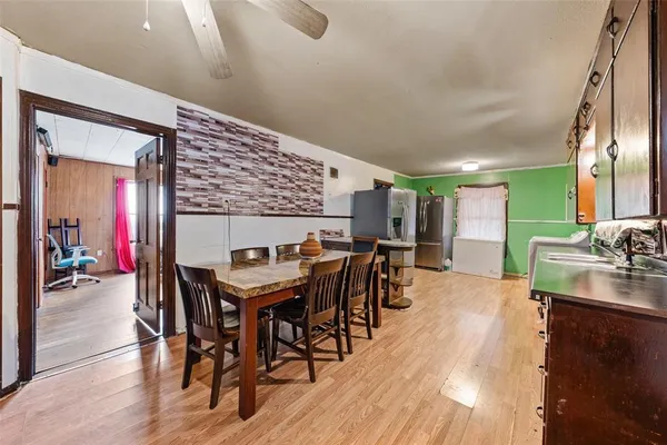 a dinning table and chairs in a room