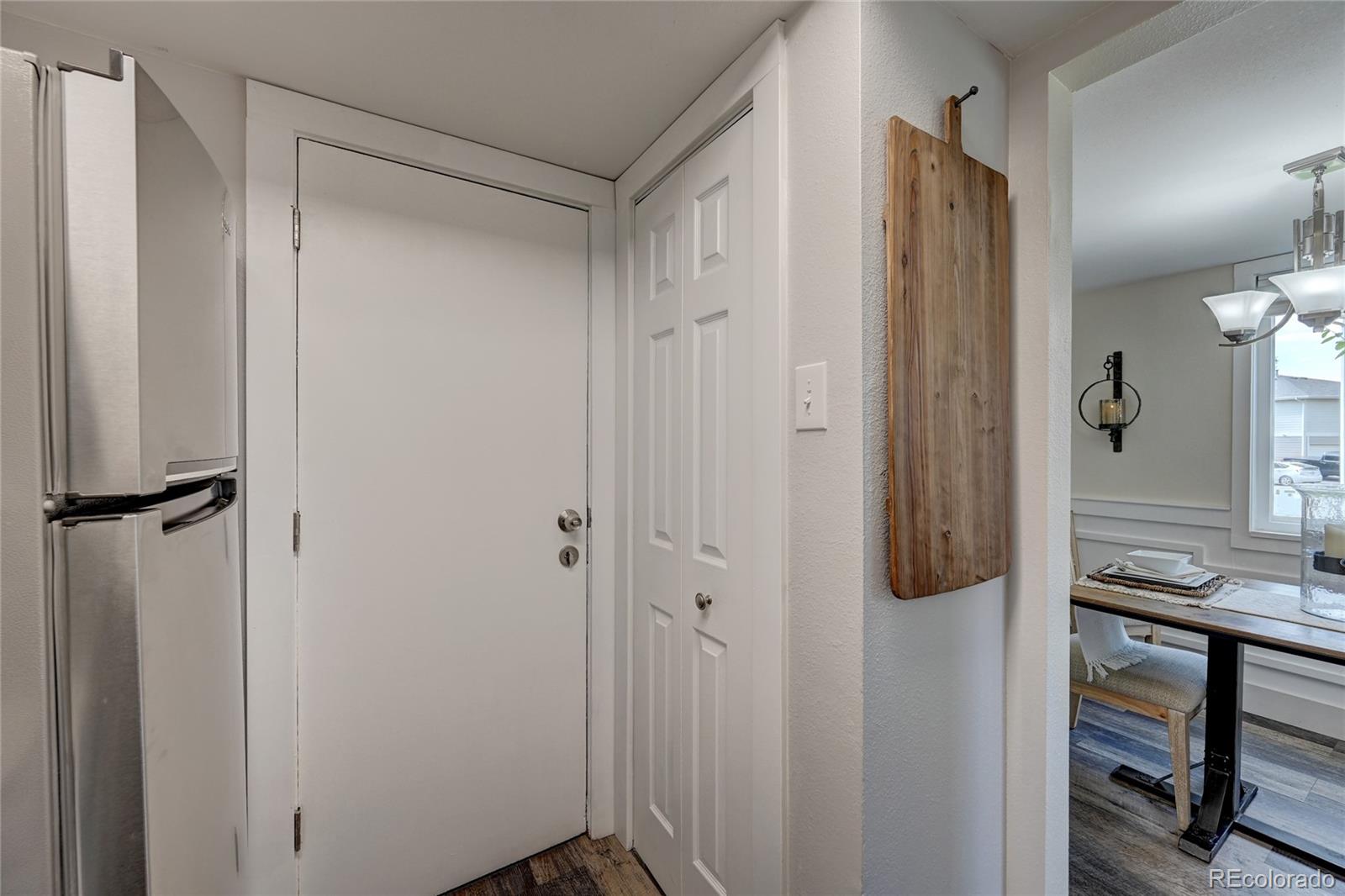 1225 South Oneida Street, Unit 219 Denver, CO 80224 - Photo 11 of 25 a view of a bathroom from a hallway