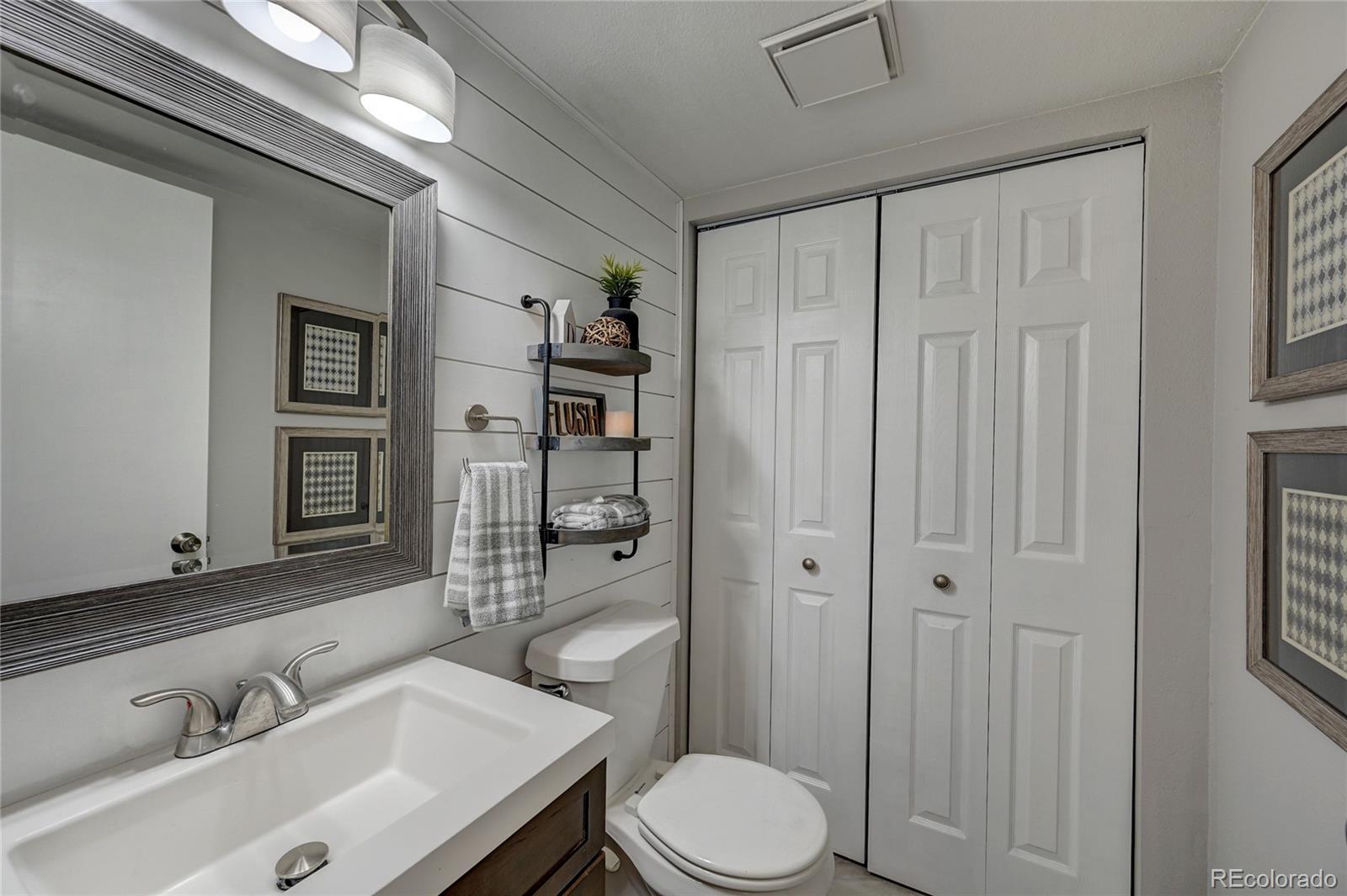 1225 South Oneida Street, Unit 219 Denver, CO 80224 - Photo 12 of 25 a bathroom with a sink toilet and shower