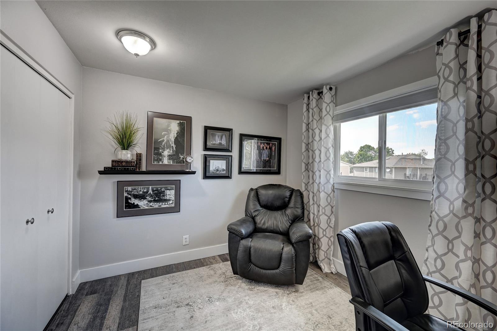 1225 South Oneida Street, Unit 219 Denver, CO 80224 - Photo 19 of 25 a room with furniture and a window