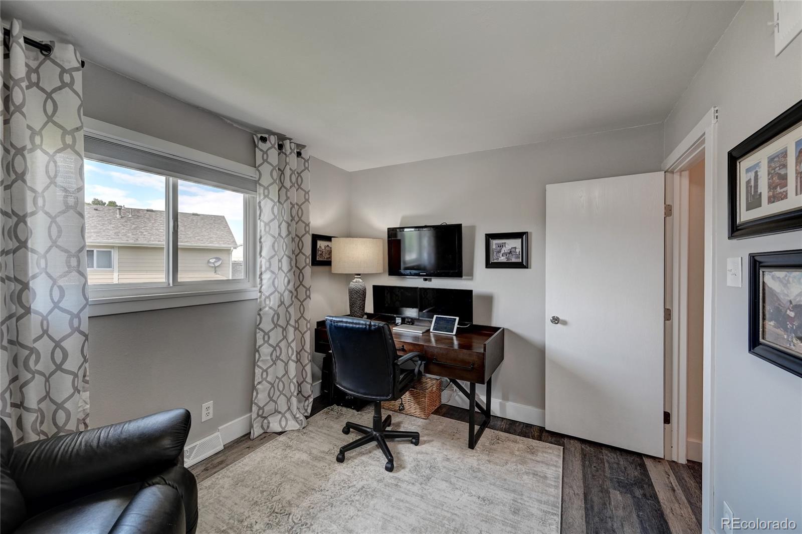 1225 South Oneida Street, Unit 219 Denver, CO 80224 - Photo 20 of 25 a view of a workspace with furniture and a window