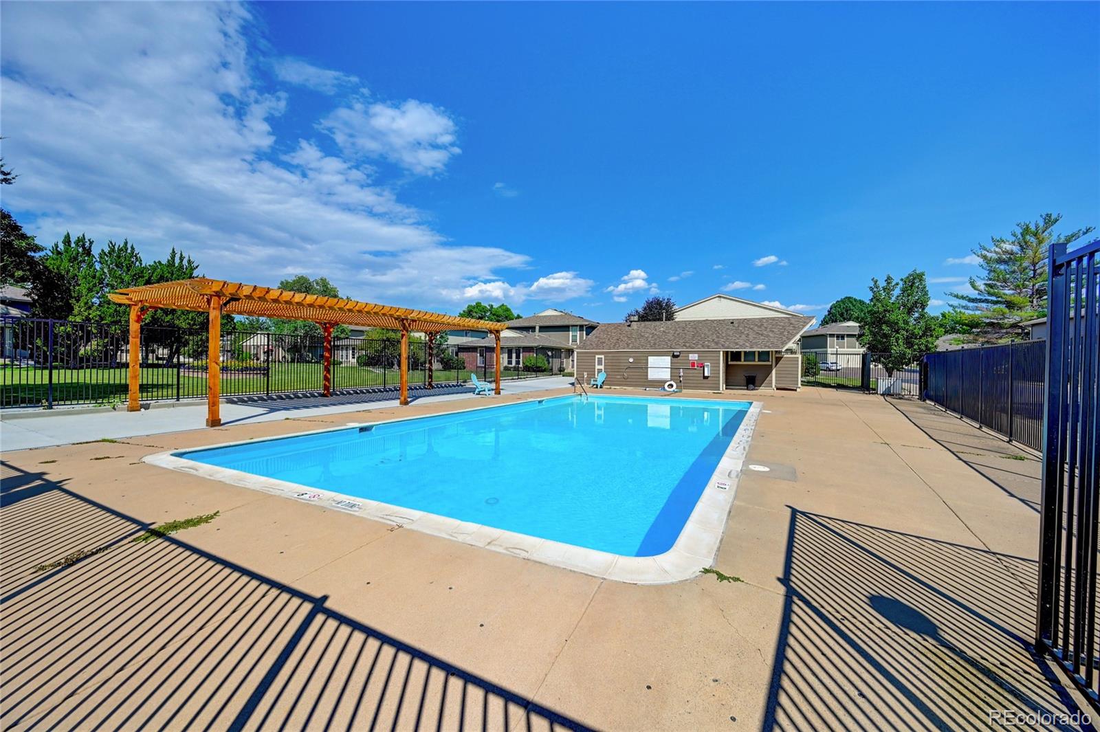 1225 South Oneida Street, Unit 219 Denver, CO 80224 - Photo 24 of 25 a view of a swimming pool with an outdoor seating