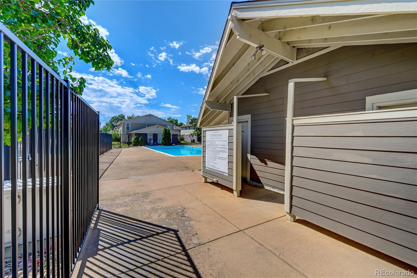 1225 South Oneida Street, Unit 219 Denver, CO 80224 - Photo 25 of 25 a view of a house with a door and wooden walls