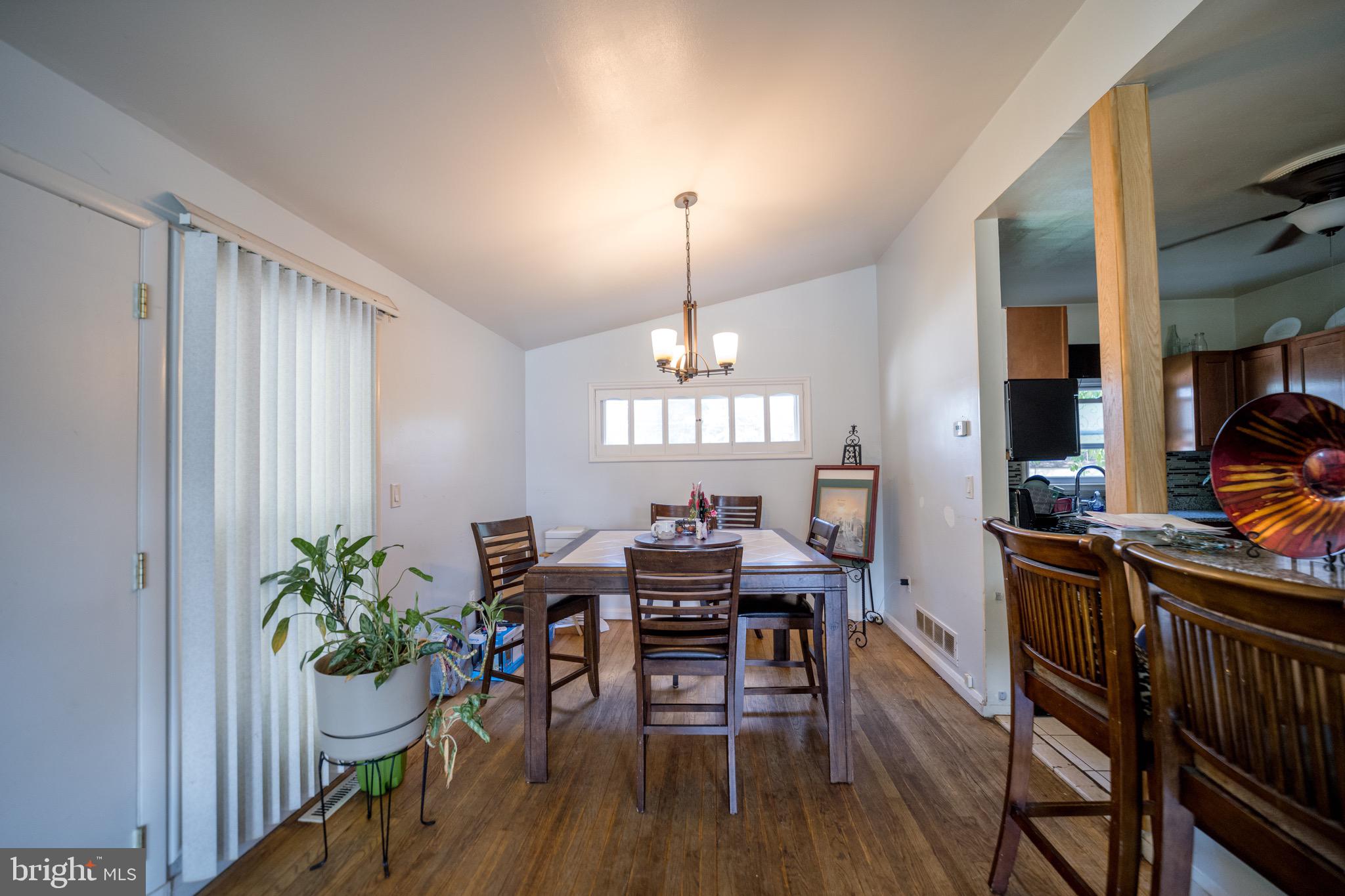 4125 Ronis Road Pikesville, MD 21208 - Photo 34 of 40 a view of a dining room with furniture window and wooden floor