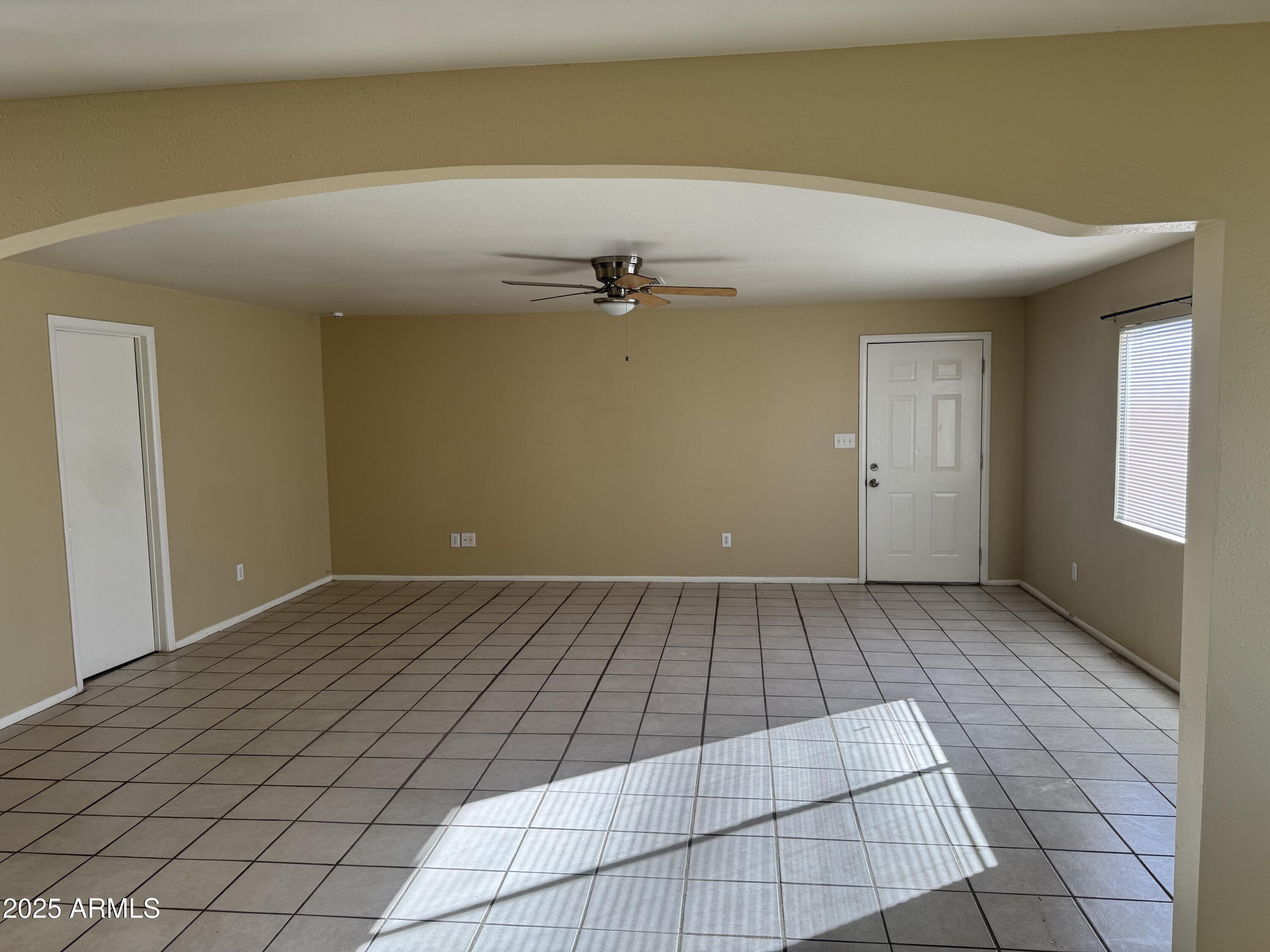 4016 East Eugie Avenue Phoenix, AZ 85032 - Photo 4 of 8 an empty room with windows