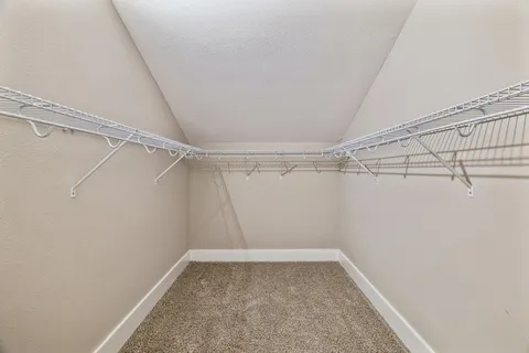a view of a room with racks on the wall