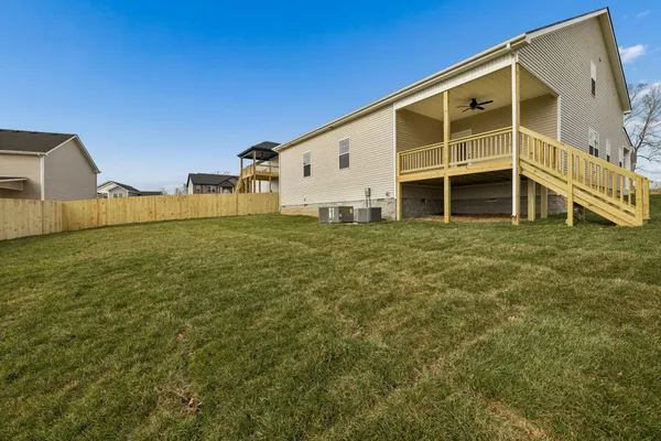 a view of a backyard with large trees