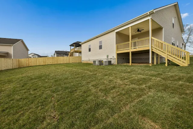 a view of a backyard with large trees