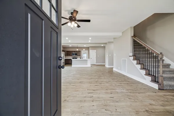 a view of entryway and hall with a bath tub