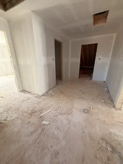 a view of empty room with a fireplace