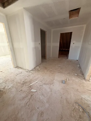 a view of empty room with a fireplace