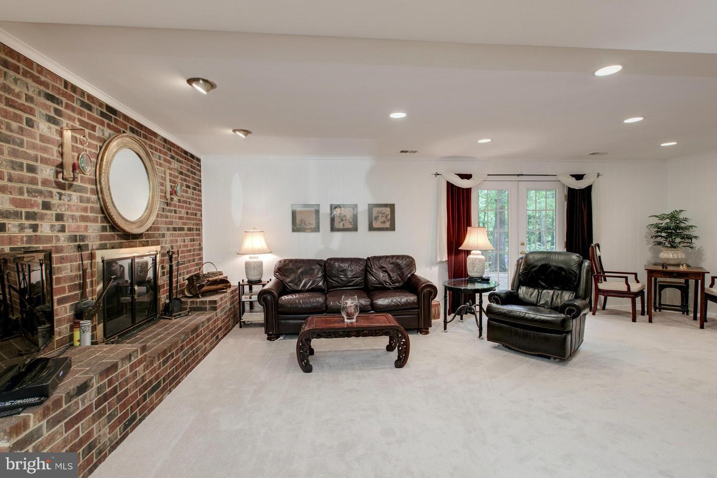 6115 Roxbury Avenue Springfield, VA 22152 - Photo 19 of 24 Family Room with Fireplace on Lower Level