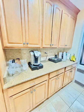 a kitchen with sink and cabinets