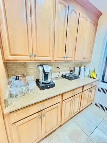 a kitchen with sink and cabinets