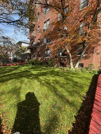 a backyard of a house with lots of green space and garden