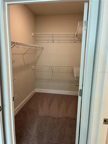 a view of a room with racks on the wall