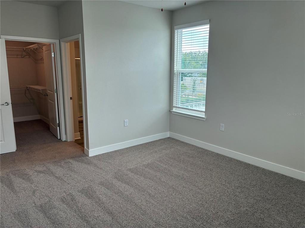 2115 Waterfall Ct Mount, Unit 8211 Mount Dora, FL 32757 - Photo 15 of 21 an empty room with windows