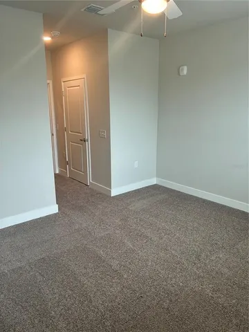 a view of an empty room and closet
