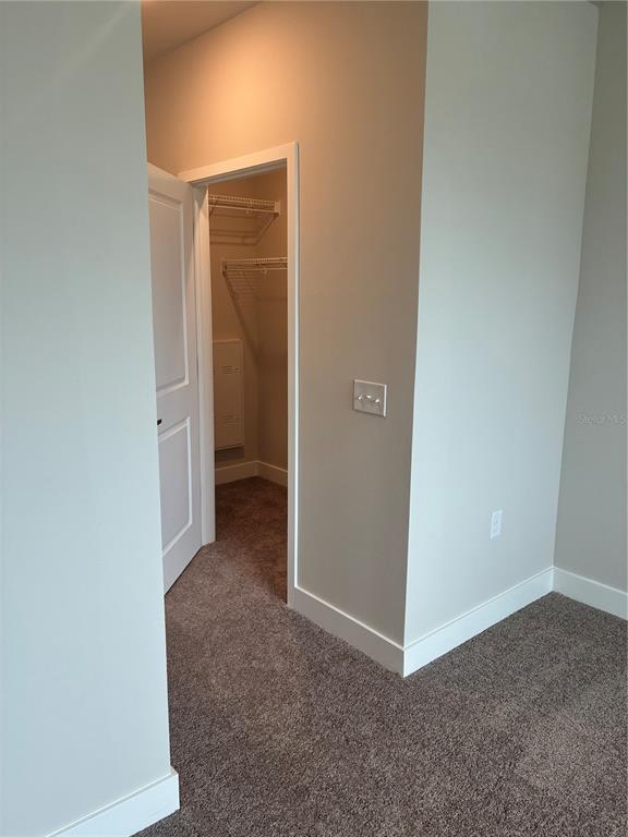 2115 Waterfall Ct Mount, Unit 8211 Mount Dora, FL 32757 - Photo 20 of 21 a view of an empty room and closet