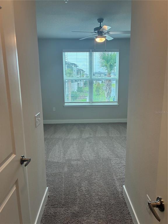 2115 Waterfall Ct Mount, Unit 8211 Mount Dora, FL 32757 - Photo 21 of 21 a view of an empty room with a window