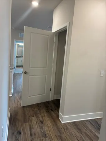 an empty room with wooden floor