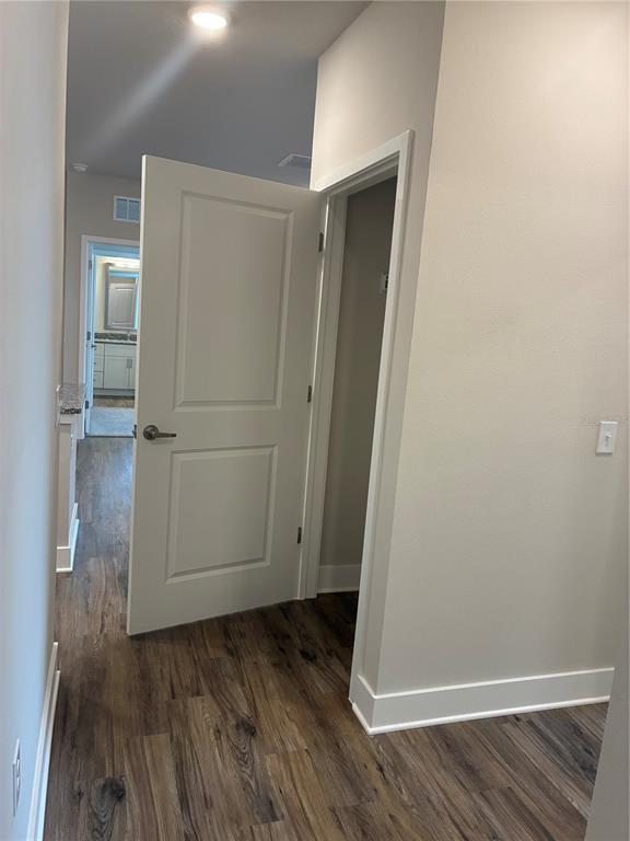 2115 Waterfall Ct Mount, Unit 8211 Mount Dora, FL 32757 - Photo 3 of 21 an empty room with wooden floor