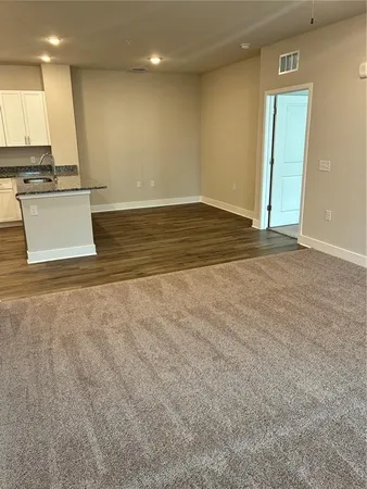 a view of a kitchen with a sink and a window