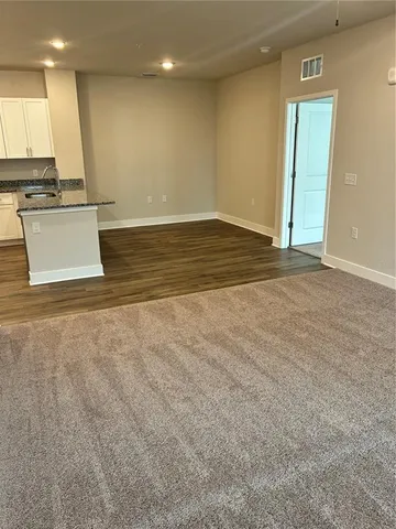 a view of a kitchen with a sink and a window