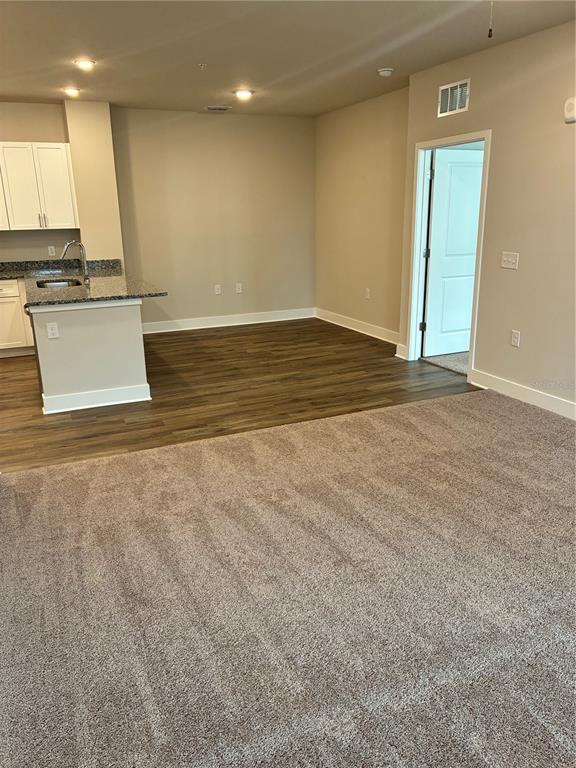 2115 Waterfall Ct Mount, Unit 8211 Mount Dora, FL 32757 - Photo 10 of 21 a view of a kitchen with a sink and a window
